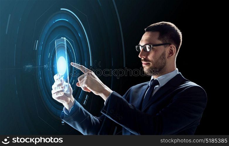 business, augmented reality and future technology concept - businessman in glasses working with transparent tablet pc computer and hologram over black background. businessman working with transparent tablet pc