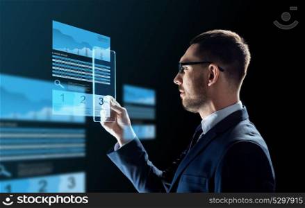 business, augmented reality and future technology concept - businessman in glasses working with transparent tablet pc computer and virtual exchange charts projections over black background. businessman with tablet pc and exchange charts