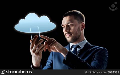 business, augmented reality and future technology concept - businessman in suit working with transparent smartphone and cloud computing hologram over black background. businessman with transparent smartphone. businessman with transparent smartphone