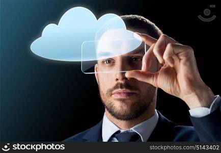 business, augmented reality and future technology concept - businessman in suit working with transparent smartphone and cloud computing hologram over black background. businessman with transparent smartphone