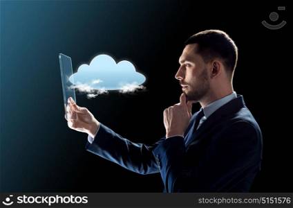 business, augmented reality and future technology concept - businessman in suit working with transparent tablet pc computer and cloud computing hologram over black background. businessman working with transparent tablet pc
