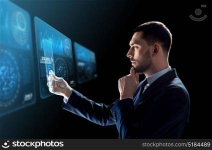 business, augmented reality and future technology concept - businessman in suit working with transparent tablet pc computer and virtual screens projections over black background. businessman with tablet pc and virtual screens