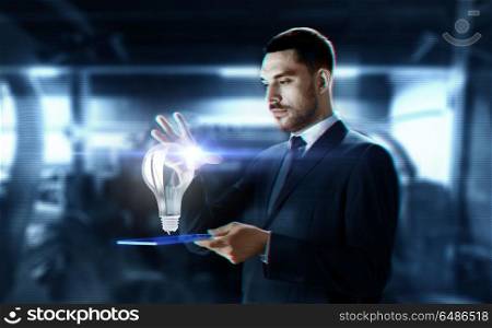 business, augmented reality and future technology concept - businessman in suit working with transparent tablet pc computer and hologram over abstract background. businessman with transparent tablet and hologram. businessman with transparent tablet and hologram