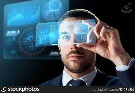 business, augmented reality and future technology concept - businessman working with transparent smartphone and virtual screens projections over black background. businessman with smartphone and virtual screens