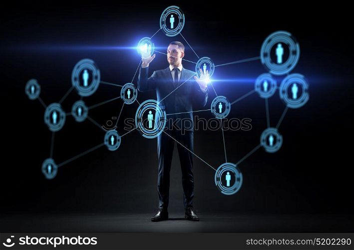 business, augmented reality and human resources concept - businessman with virtual network contacts over black background. businessman with virtual network contacts