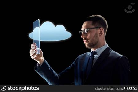 business, augmented reality and modern technology concept - businessman in glasses working with transparent tablet pc computer and cloud computing hologram over black background. businessman working with transparent tablet pc