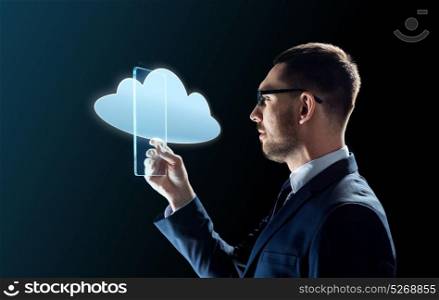 business, augmented reality and modern technology concept - businessman in glasses working with transparent tablet pc computer and cloud computing hologram over black background. businessman working with transparent tablet pc