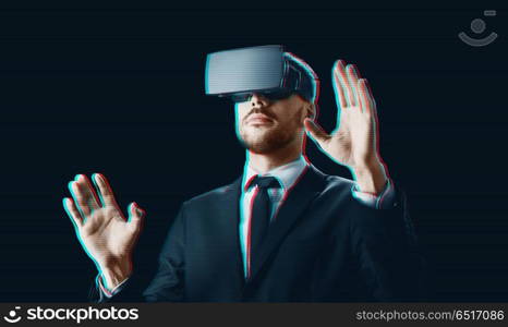 business, augmented reality and technology concept - businessman in virtual headset over black background. businessman in virtual reality headset over black. businessman in virtual reality headset over black