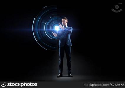 business, augmented reality, people and future technology concept - businessman in suit working with virtual projection over black background. businessman in suit with virtual projection