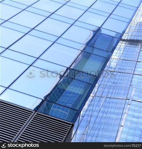 Business background - glass walls of a office building