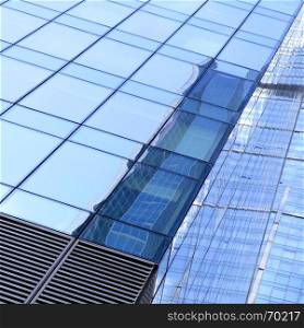 Business background - glass walls of a office building