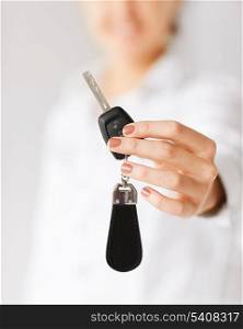 business, banking, vehicle, rental, automotive concept - woman hand holding car key