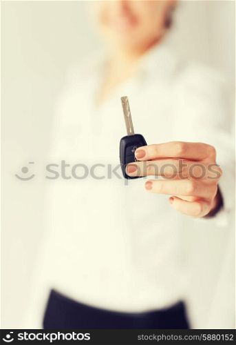 business, banking, vehicle, rental, automotive concept - woman hand holding car key
