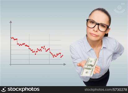 business, bankruptcy, people and banking concept - smiling businesswoman in eyeglasses with dollar cash money over gray background and forex graph going down