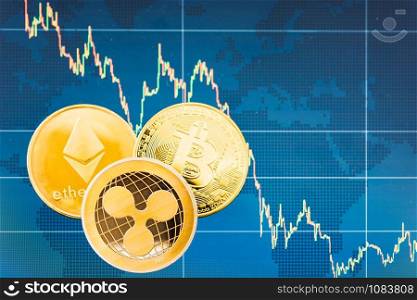 Business Bitcoin, ripple XRP and Ethereum coins currency finance money on graph chart background