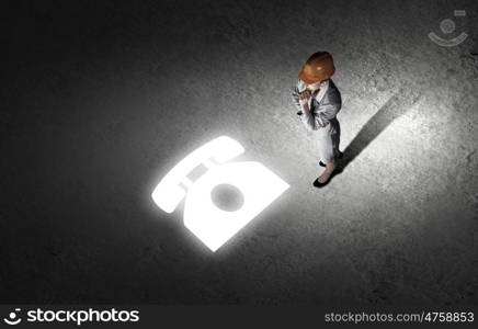 Business break. Top view of businesswoman wearing yellow helmet