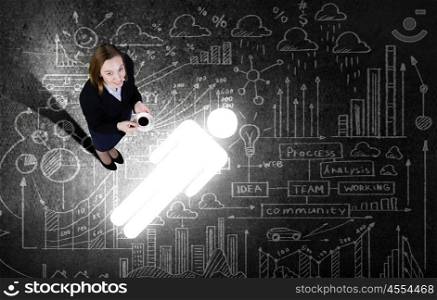 Business break. Top view of businesswoman with cup of coffee in hands