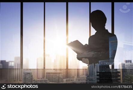 business, building, architecture, industry and people concept - silhouette of woman with clipboard over double exposure office and city background