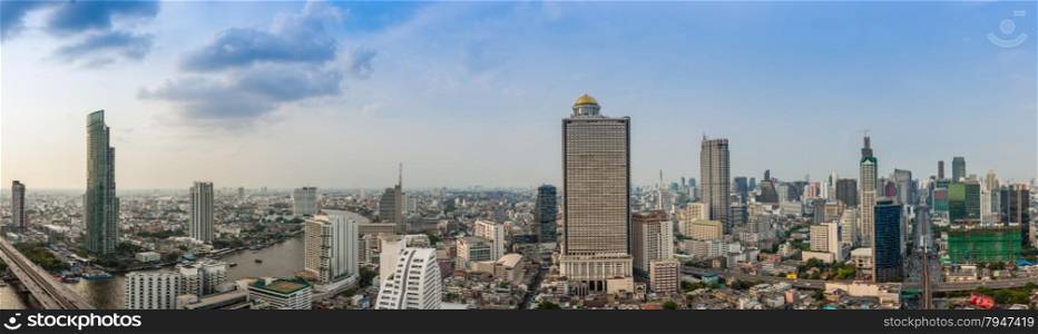 Business Building Bangkok city area at day time with transportation car and ship as panorama, high angle bird eyes view