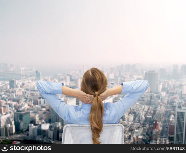 business, building, development and office people concept - businesswoman sitting on chair from back over city background