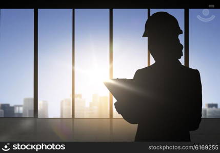 business, building, industry and people concept - silhouette of woman in helmet with clipboard