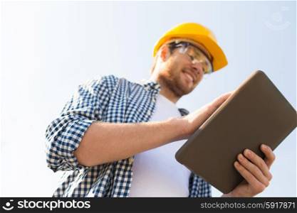 business, building, industry, technology and people concept - close up of smiling builder in hardhat with tablet pc computer outdoors