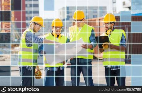 business, building, teamwork, technology and people concept - group of smiling builders in hardhats and highly visible vests looking at blueprint and clipboard outdoors over squared grid background