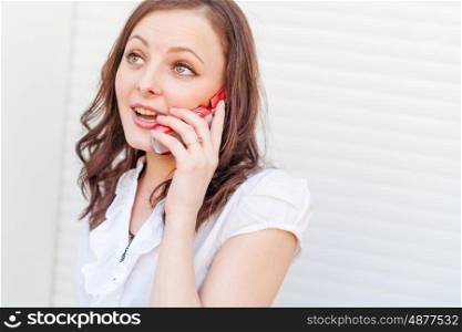 Business call. 20s brunette women using cell phone indoor