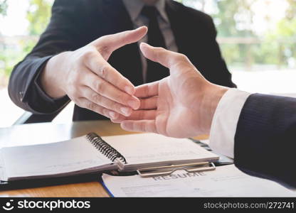 Business, career and placement concept, boss and employee handshaking after successful negotiations or interview