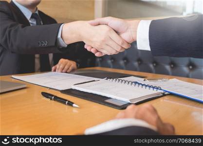 Business, career and placement concept, boss and employee handshaking after successful negotiations or interview
