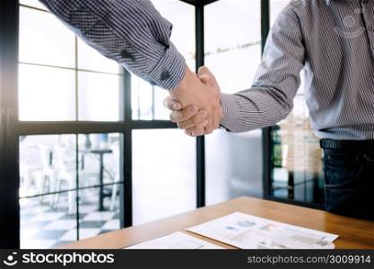 business ceo colleagues hand shaking at a office