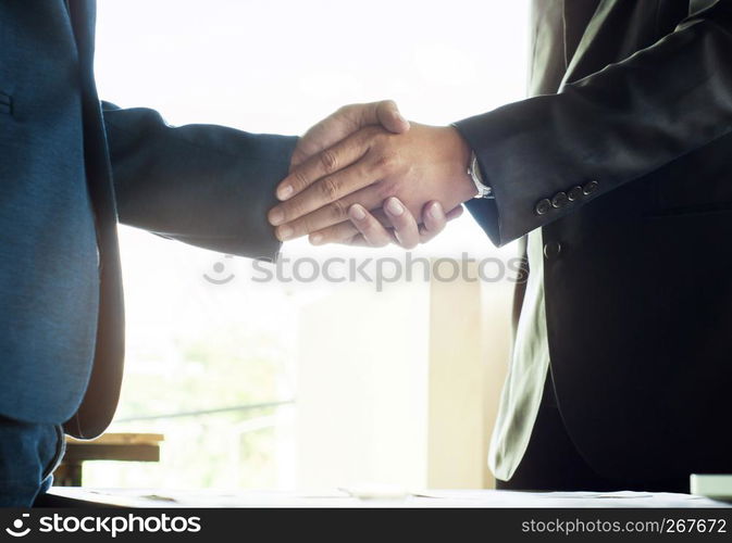 business ceo hands shaking while meeting