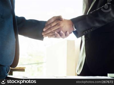 business ceo hands shaking while meeting