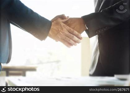 business ceo hands shaking while meeting selected focus on hands