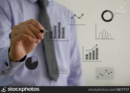 business chart and graph. Businessman touching virtual screen hologram. Investment business and economic concept. business chart and graph. Businessman touching virtual screen hologram.