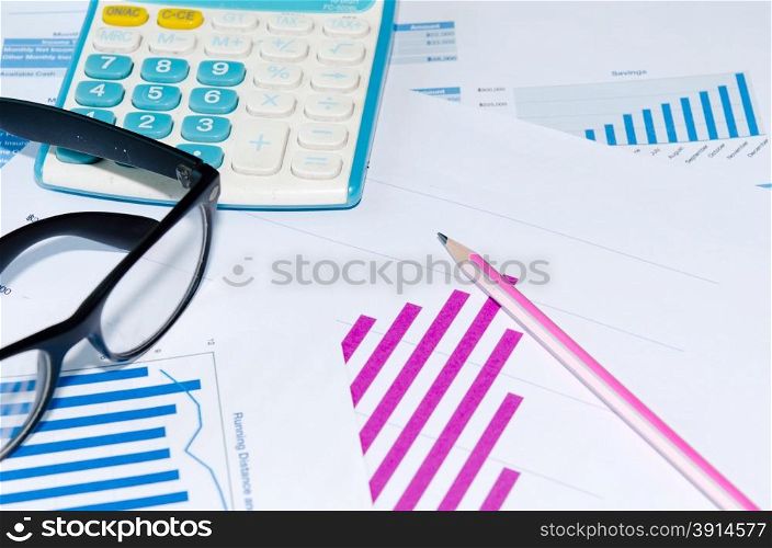 Business chart and pencil is placed on the table.