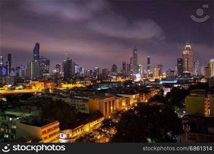 business cityscape area and modern building city and transportation urban area at dusk twilight night sky of bangkok thailand