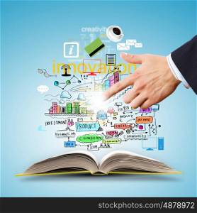 Business collage. Opened book with business concept icons and hand making choice