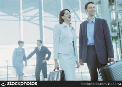 Business colleagues in airport terminal