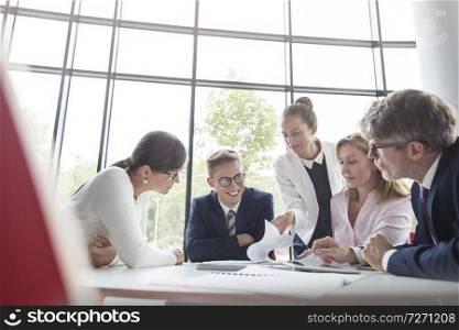 Business colleagues planning at table during meeting in office