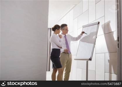 Business colleagues planning for presentation in office
