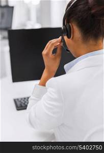 business, communication and call center concept - friendly female helpline operator with headphones and computer