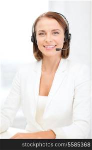 business, communication and call center concept - smiling female helpline operator with headphones in call center