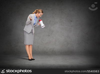 business, communication and office concept - angry businesswoman with megaphone screaming at someone imaginary