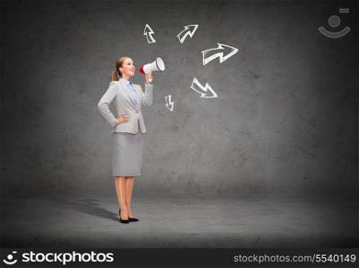 business, communication and office concept - smiling businesswoman with megaphone screaming at someone imaginary