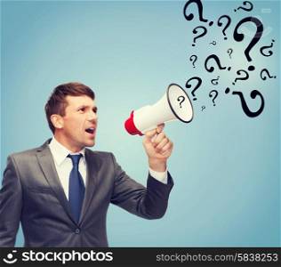 business, communication, hiring, searching, public announcement, office concept - buisnessman with bullhorn or megaphone and question marks