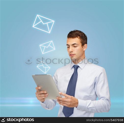 business, communication, modern technology and office concept - confident buisnessman with tablet pc and envelope