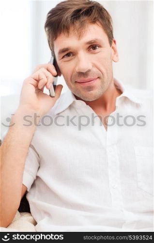 business, communication, modern technology concept - buisnessman with cell phone