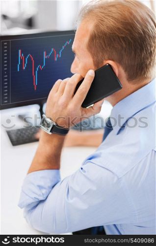 business, communication, money and technology concept- businessman with smartphone and forex chart on monitor screen in office