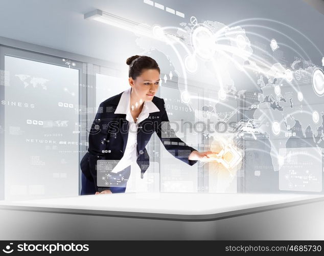 Business communications. Image of young businesswoman clicking icon on high-tech picture